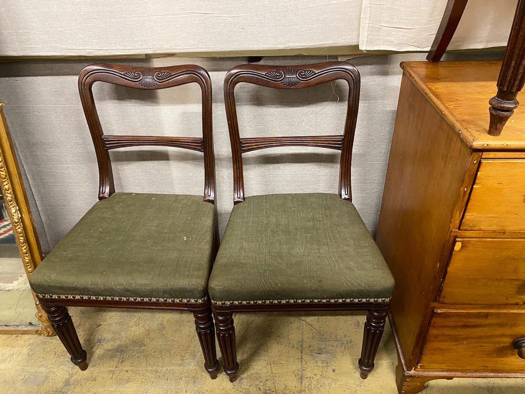 A set of eight early Victorian mahogany dining chairs on turned fluted legs